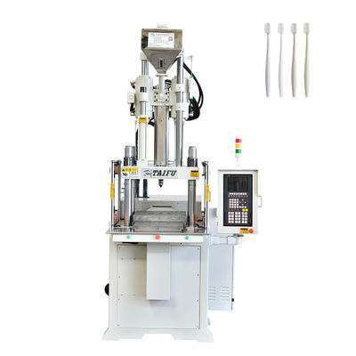 Verticale spuitgietmachine voor het maken van tandenborstels