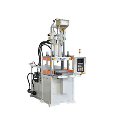 Verticale spuitgietmachine voor het maken van tandenborstels